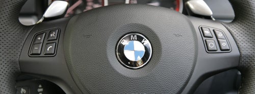 BMW 330d M Sport steering wheel with controls and logo