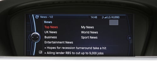 BMW 330d M Sport ConnectedDrive system displaying news update.