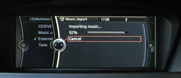 BMW ConnectedDrive screen showing 92% music import progress.