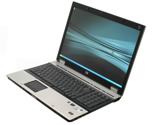 HP Elitebook 8730w laptop with screen on and lid open.