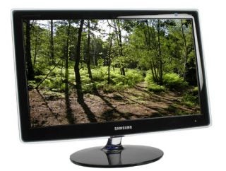 Samsung EcoFit SyncMaster P2370 monitor displaying forest scenery.