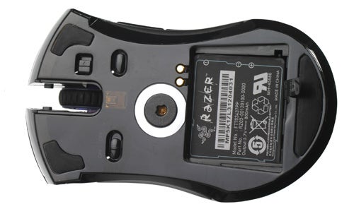 Underside view of a Razer Mamba Gaming Mouse showing sensor and battery compartment.