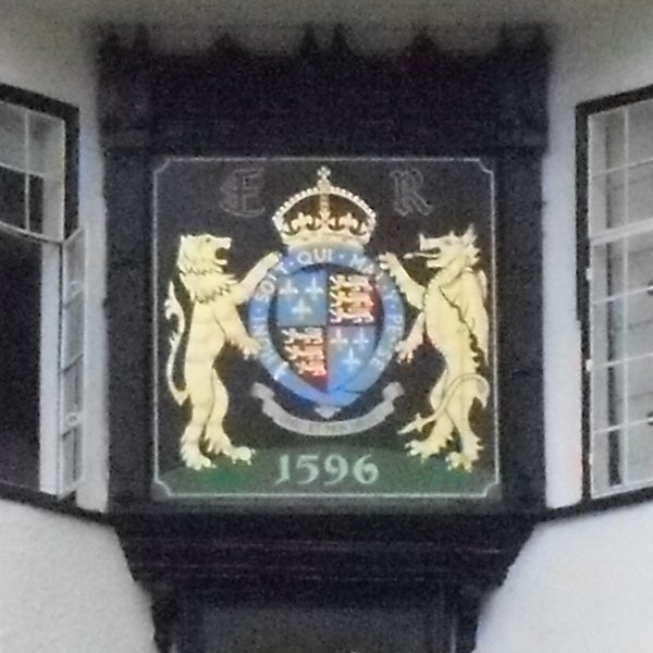 Coat of arms plaque with crown and date 