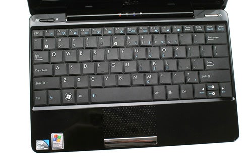 Asus Eee PC 1008HA netbook open showing keyboard and screen.