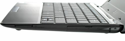 Side view of Asus Eee PC 1008HA netbook showing keyboard and ports.