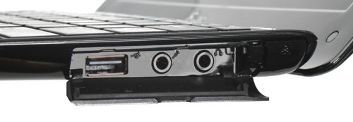 Asus Eee PC 1008HA netbook showing side ports and cover.