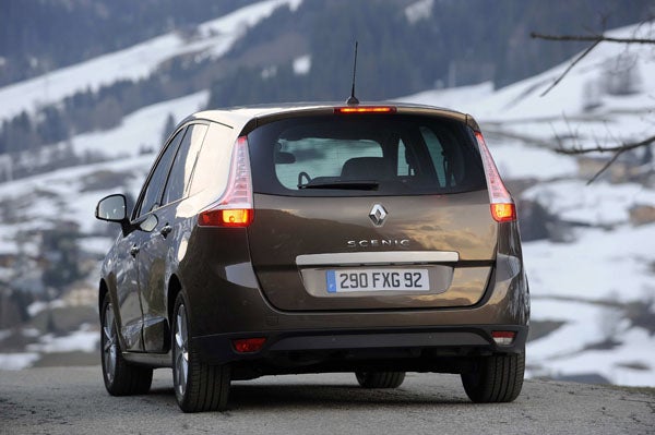 Renault Grand Scenic driving on mountain road.