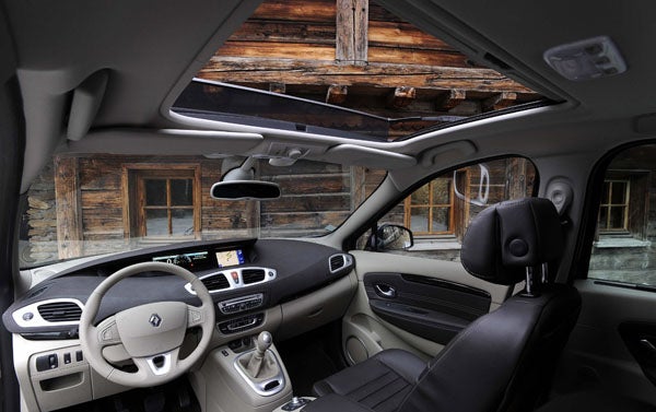 Interior view of Renault Grand Scenic with dashboard and panoramic sunroof.