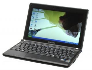 Samsung N110 netbook on with display screen visible.