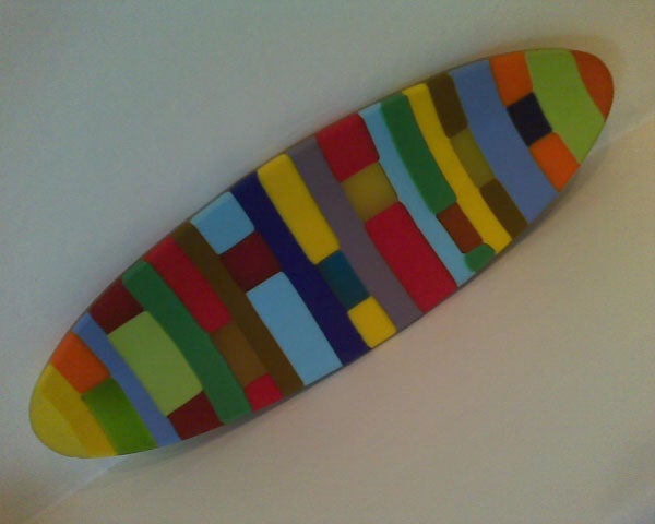 Colorful surfboard-shaped wall art.