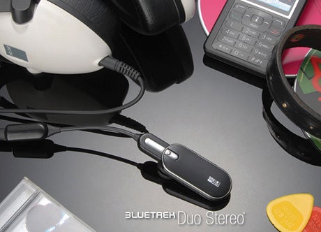 Bluetrek Duo Stereo Bluetooth Headset with mobile phone and accessories.