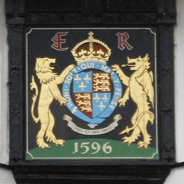 Coat of arms with lions and a motto, dated 1596.