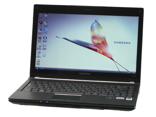 Samsung Q320 laptop with screen displaying wallpaper.