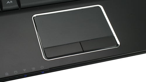 Close-up of Samsung Q320 laptop's touchpad and keyboard area.