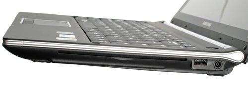 Side view of Samsung Q320 laptop showing ports and keyboard.