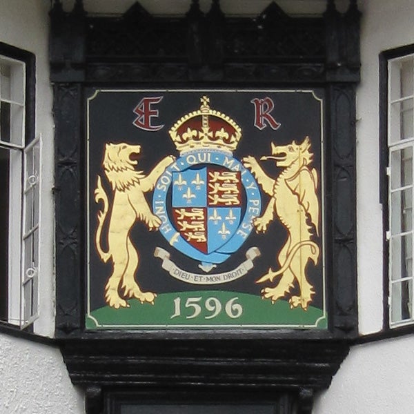 Coat of arms on black background with date 