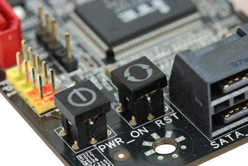 Close-up of Foxconn Blood Rage GTi motherboard power buttons.