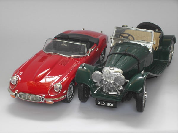 Two model cars photographed with a high-quality camera.
