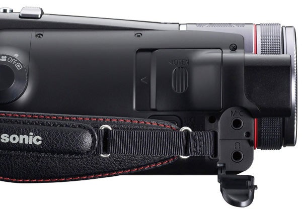 Close-up of Panasonic HDC-TM300 camcorder with wrist strap.