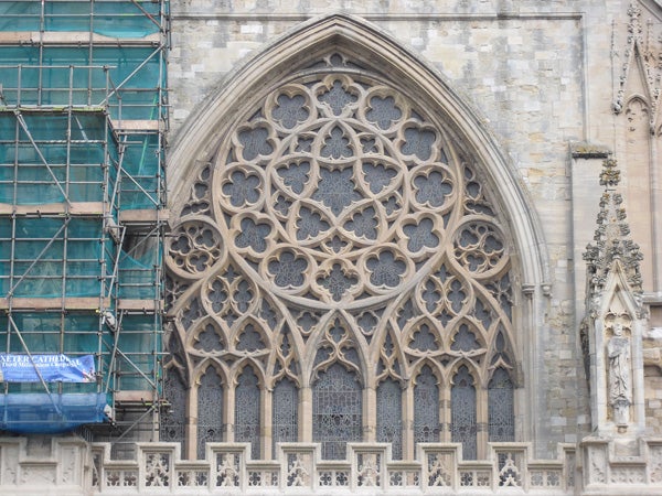 Cathedral window architecture with scaffolding on the side.