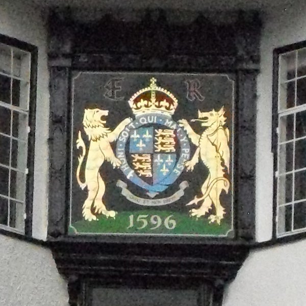 Coat of arms on a building with the date 1596.