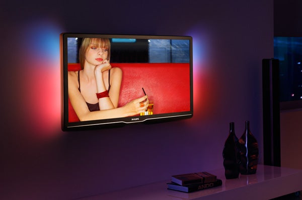 Philips 32PFL9604 LCD TV displaying vibrant image with ambient lighting.