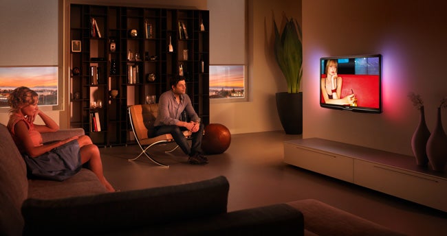 Philips LCD TV displaying content in a dimly lit living room.
