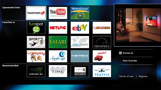 Smart TV interface with apps and a person watching TV.