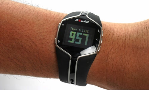 Polar FT80 fitness watch on a person's wrist displaying time.