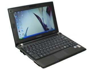 Samsung N120 Netbook open on desk showing screen and keyboard.