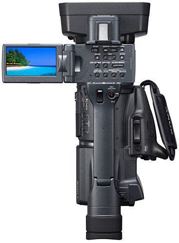 Sony Handycam HDR-FX1000E camcorder with flip-out screen displaying beach