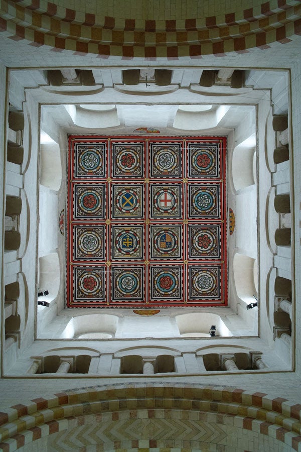 Decorative ceiling pattern viewed from below in a building.