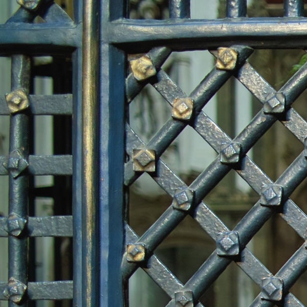 Close-up of a metal gate showing depth of field effect.