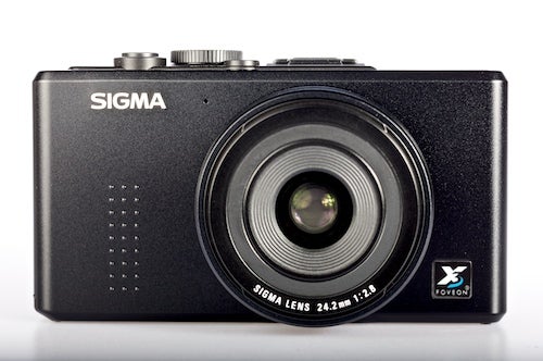 Sigma DP2 compact camera with lens on a white background.