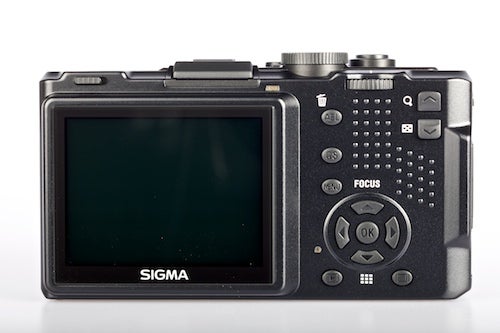 Sigma DP2 compact camera rear view showing controls and screen.