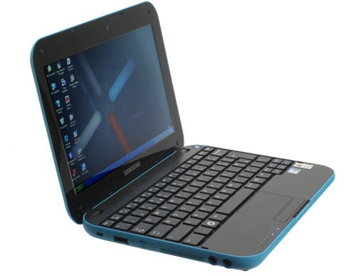Samsung N310 netbook with open lid displaying screen and keyboard.