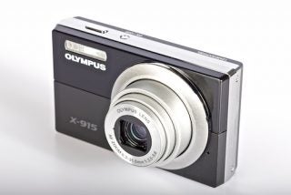 Olympus X-915 compact digital camera on white background.