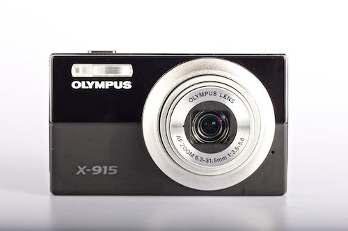 Olympus X-915 digital camera on a white background.