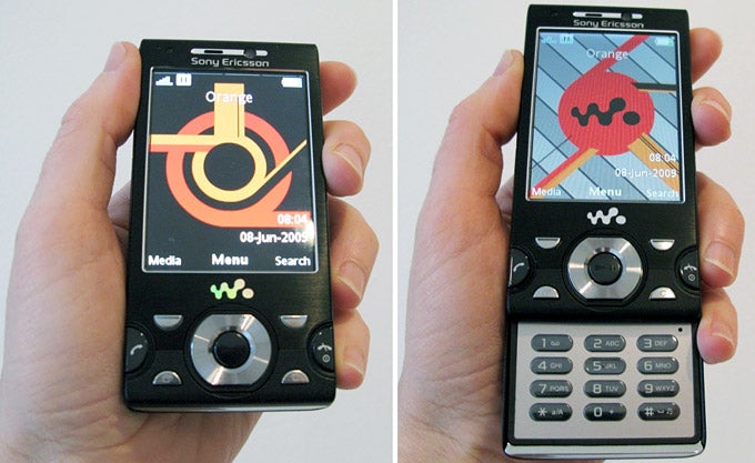 Hands holding Sony Ericsson W995 phone showcasing interface.
