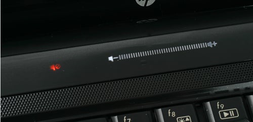 Close-up of HP Pavilion dv3 laptop's volume control and power button.