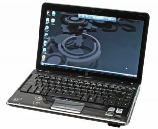 HP Pavilion dv3-2055ea laptop with open lid and powered on.