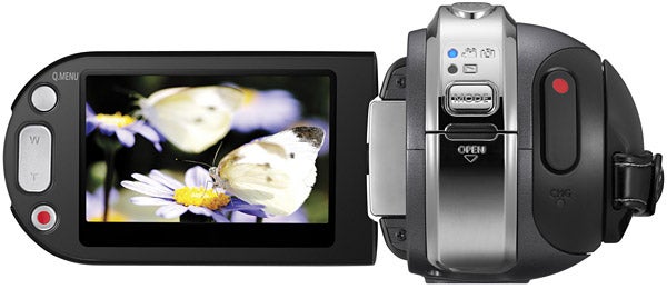 Samsung HMX-H104 camcorder with open LCD screen displaying content