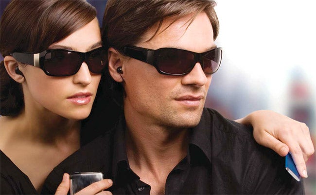 Man and woman wearing TriSpecs Bluetooth Headset Sunglasses.