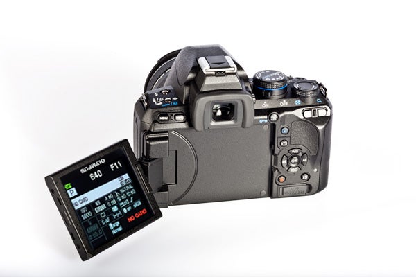 Olympus E-620 DSLR camera with articulated LCD screen open.