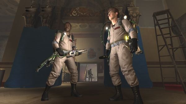 Two characters in Ghostbusters gear with proton packs.