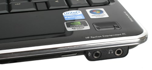 Close-up of HP Pavilion dv3-2050ea laptop corner with logos and ports.