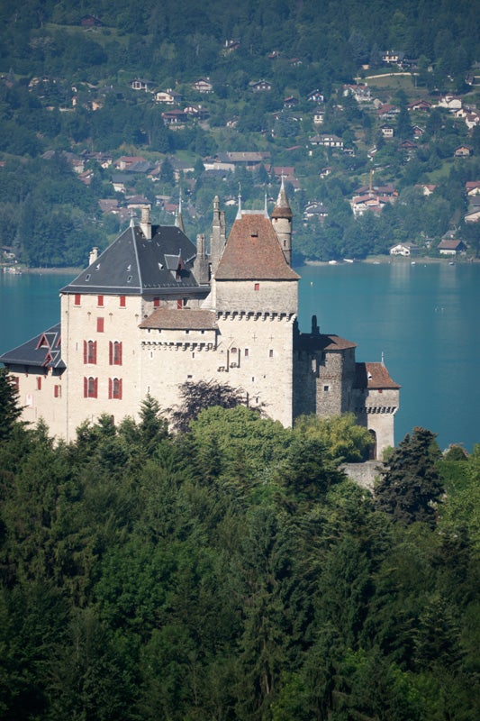 High-resolution photo of a castle by a lake.