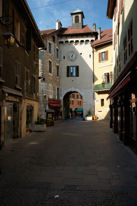 Historic European street scene with clock tower