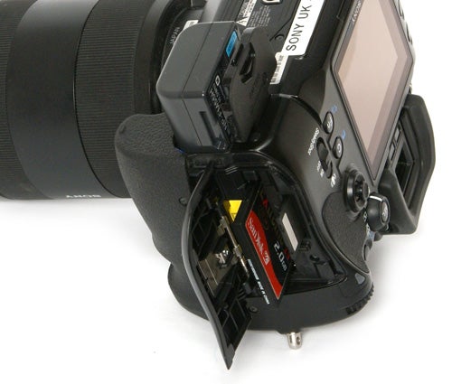 Sony Alpha A900 DSLR with open memory card slot.
