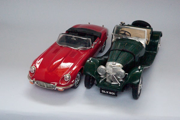 Photo showing two model cars captured with soft lighting
